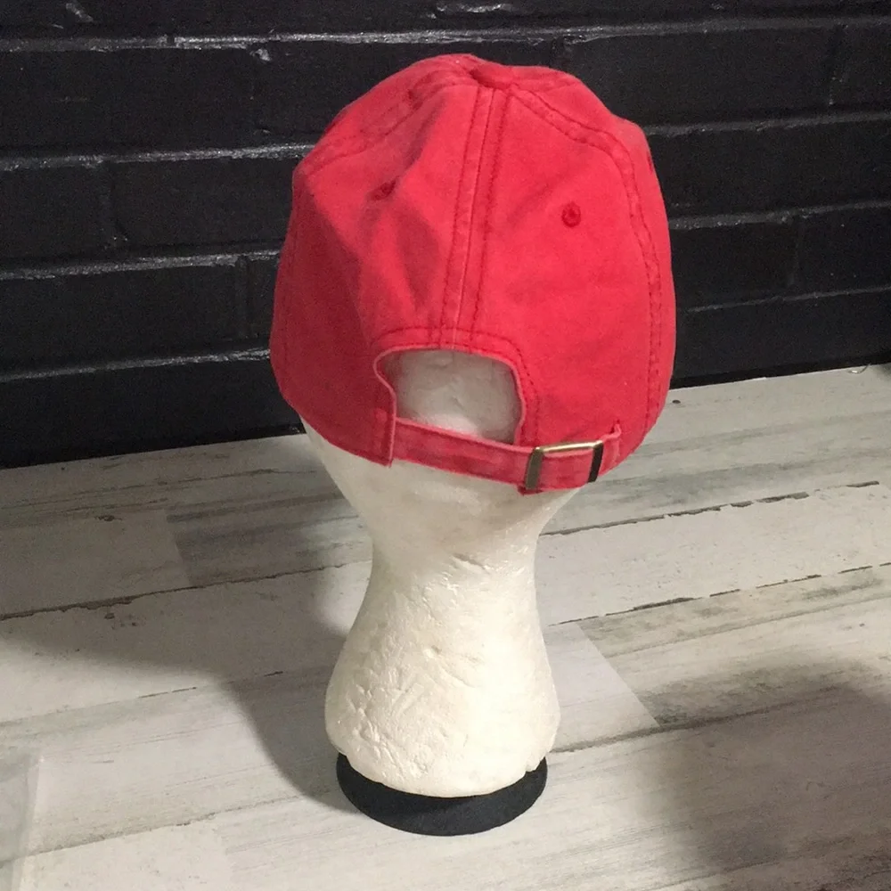 Coca-Cola red adjustable back ball cap with gold tone buckle and white emblem